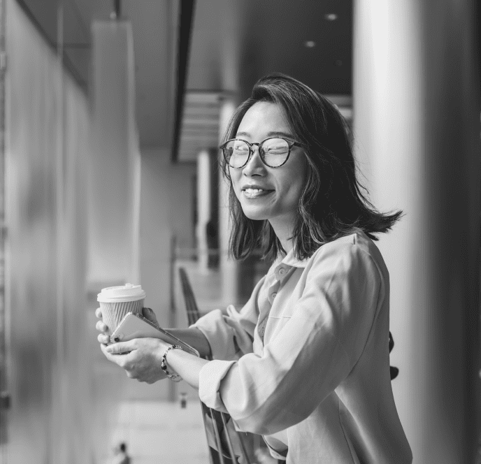 smiling chinese woman in working environment