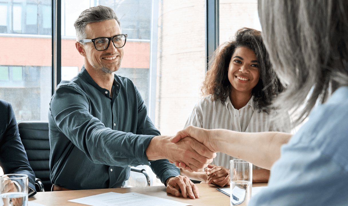 Service Level Agreements shown by two people handshaking