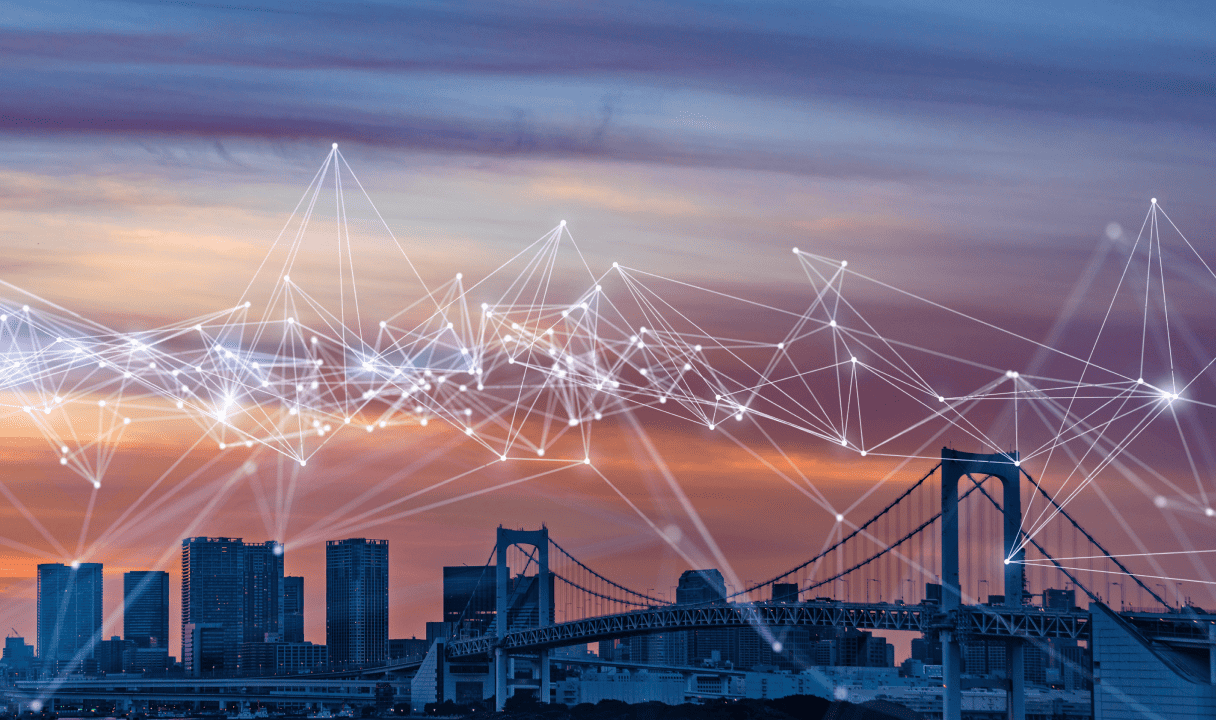 Connectivity illustrated above a modern cityscape at night